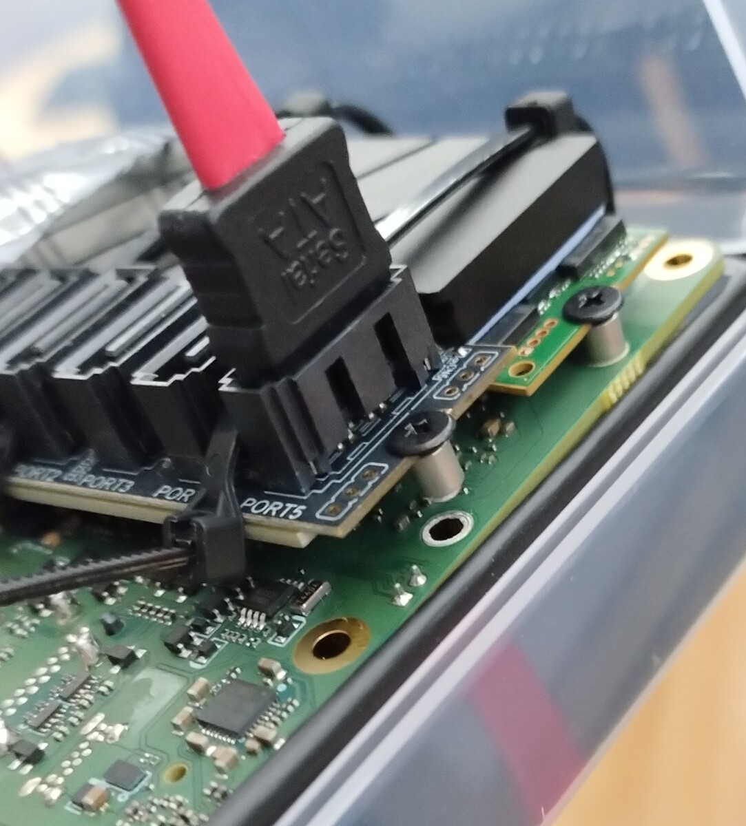 M2 SATA adapter floating on one end because the pillar holding the M2 screw to the board got loose.