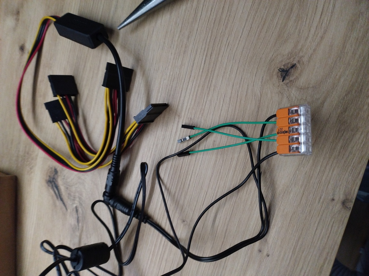 SATA power supply connected to fixture with Dupont wires sticking out