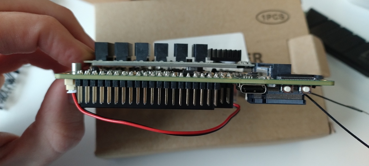 M2 SATA adapter board bending into an arc due to a very thick power resistor on the PCB.